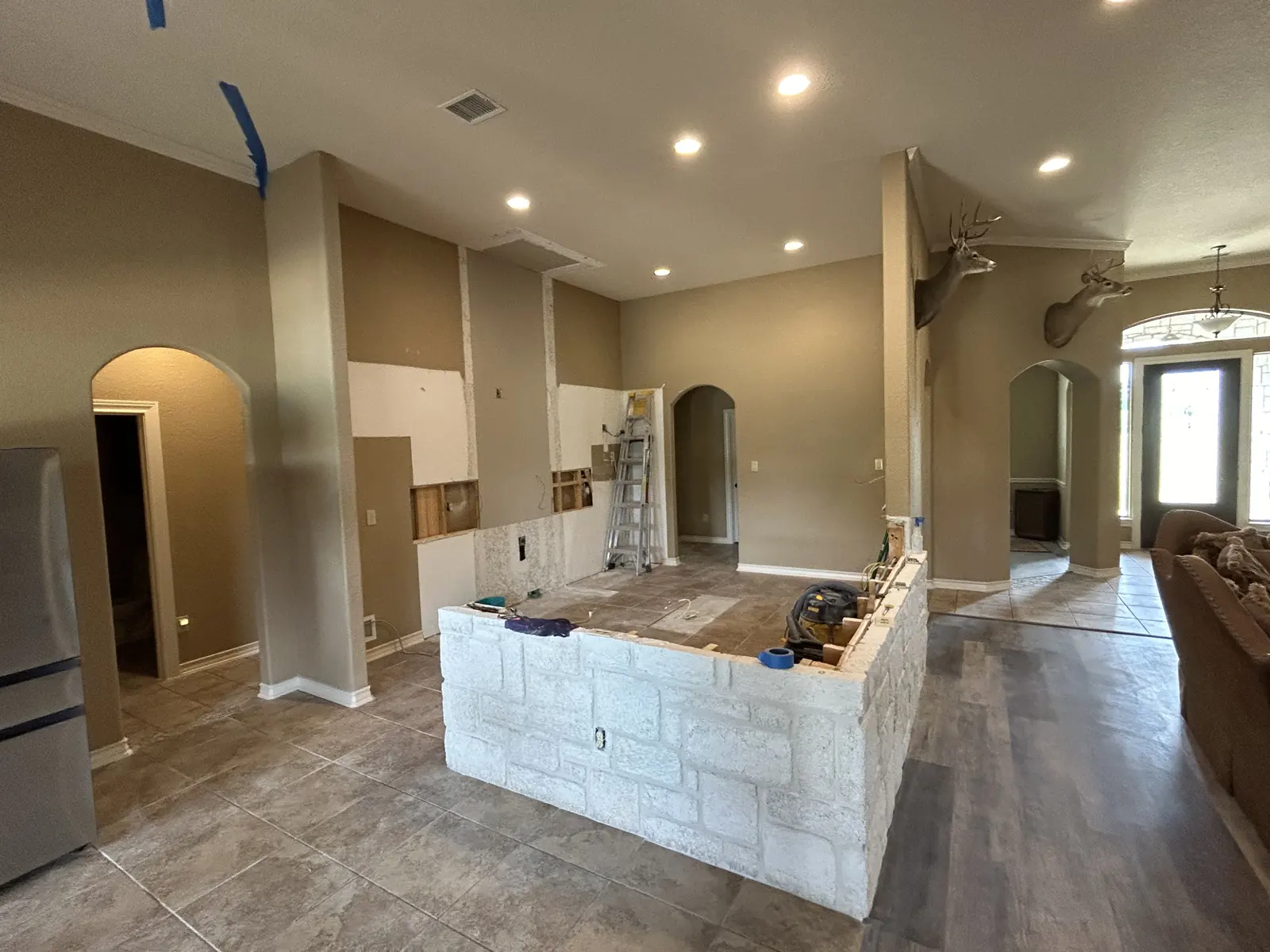 Boerne kitchen mid remodel with cabinets out and the bar partly demolished