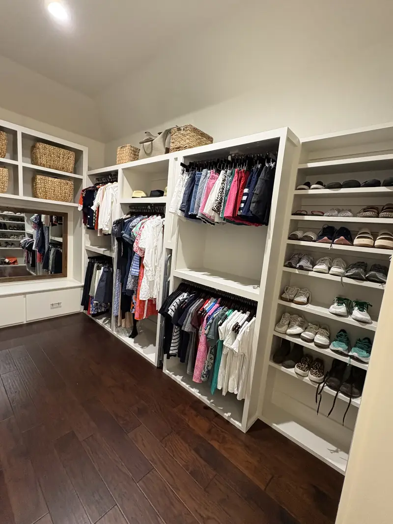 Custom walk in closet with drawers, shelving and shoe storage