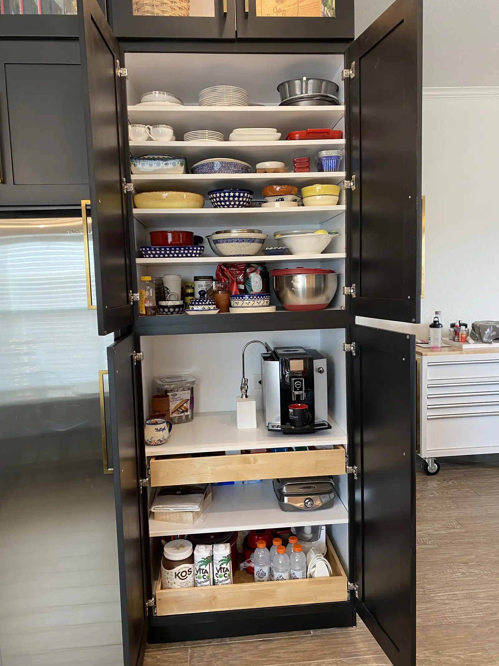 Pull out pantry storage inside a custom kitchen cabinet