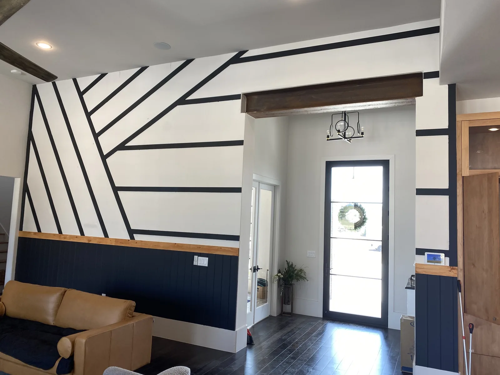 Honeycomb lattice millwork in wood on a grey wall