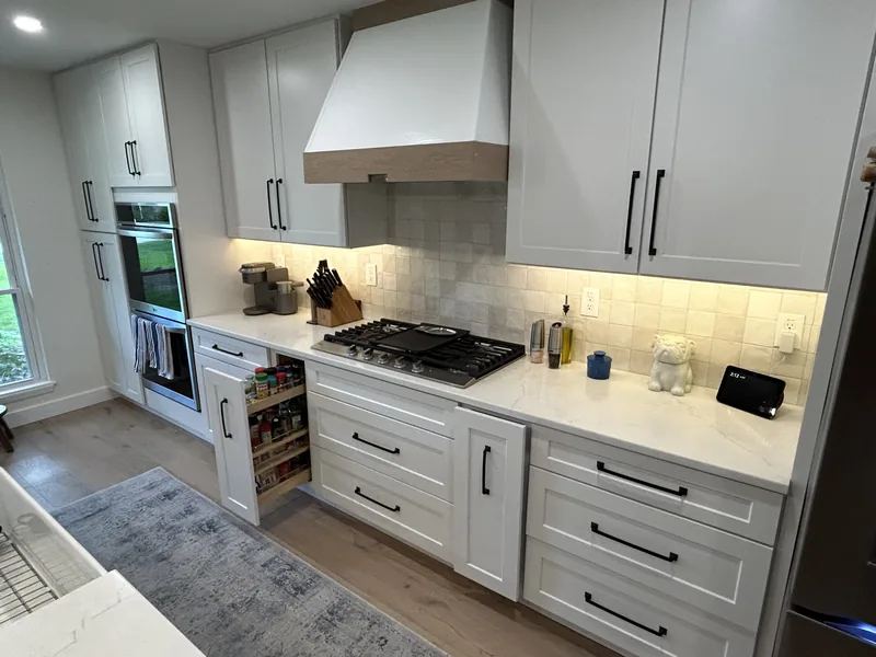 Wood wrapped range hood detail in the finished Hollywood Park kitchen