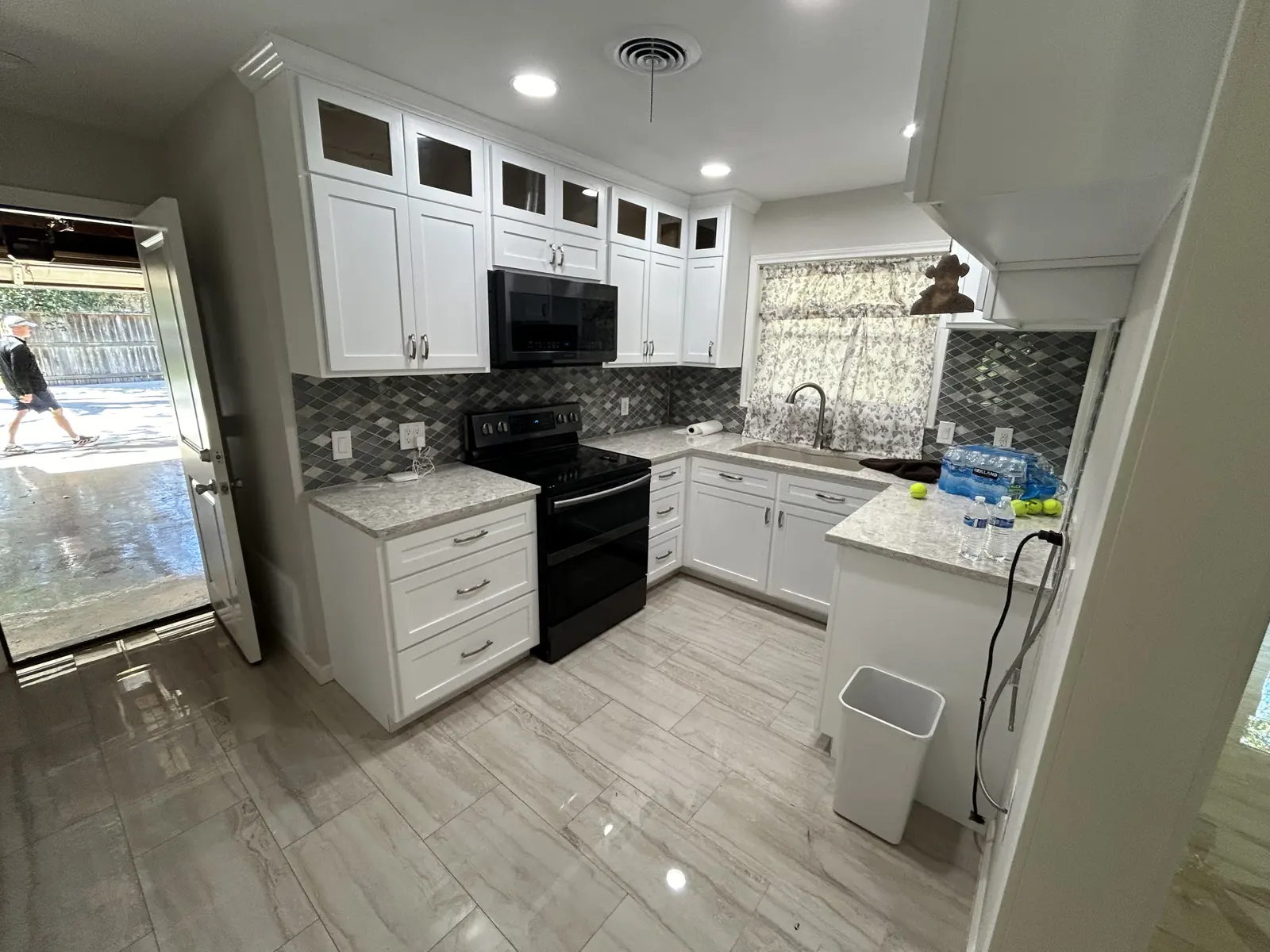 Closed off kitchen before remodeling with dated cabinets