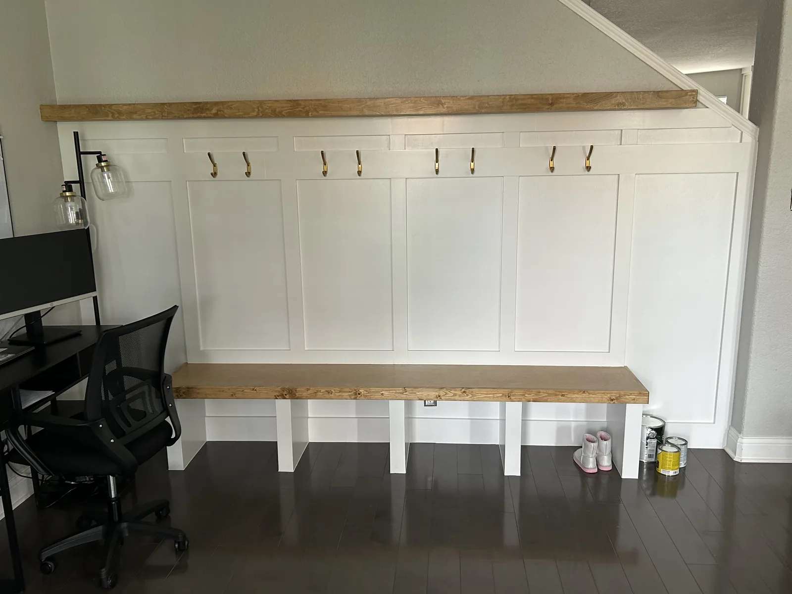 Board and batten lockers with hooks and a wood bench