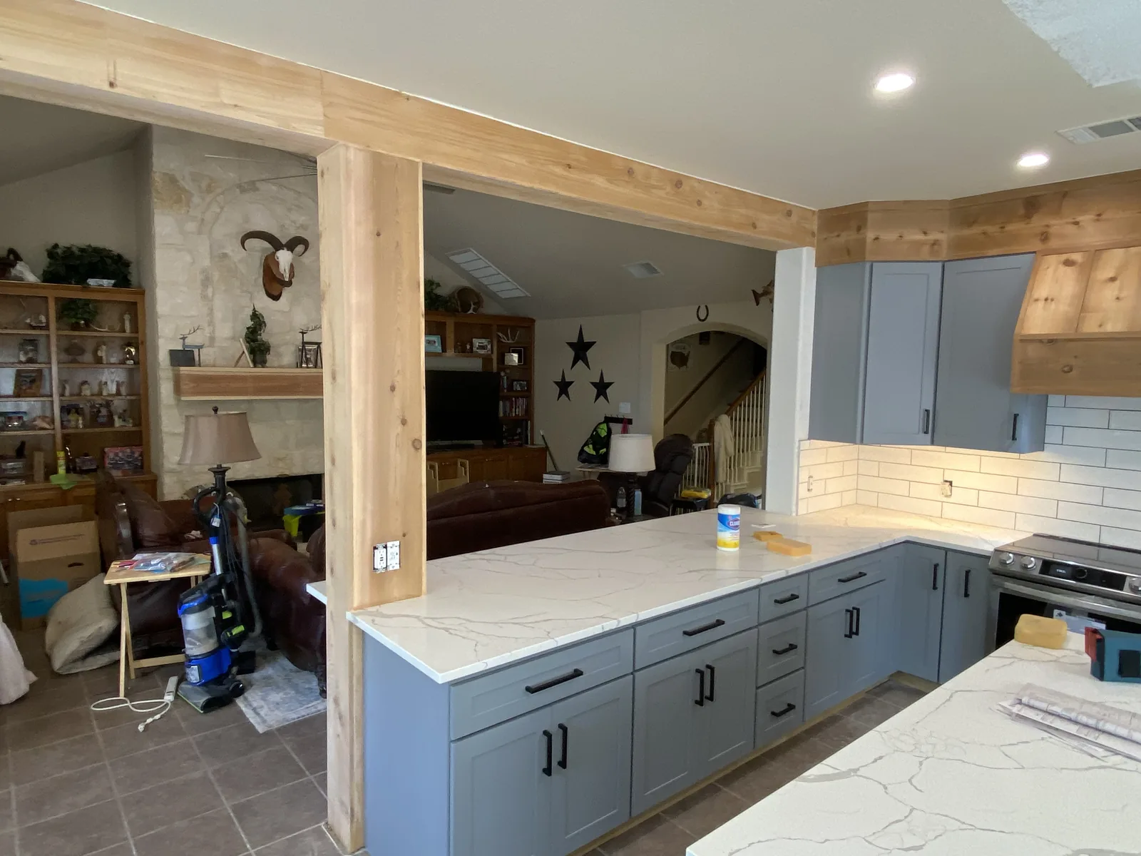 Schertz kitchen run with blue grey cabinetry and quartz counters