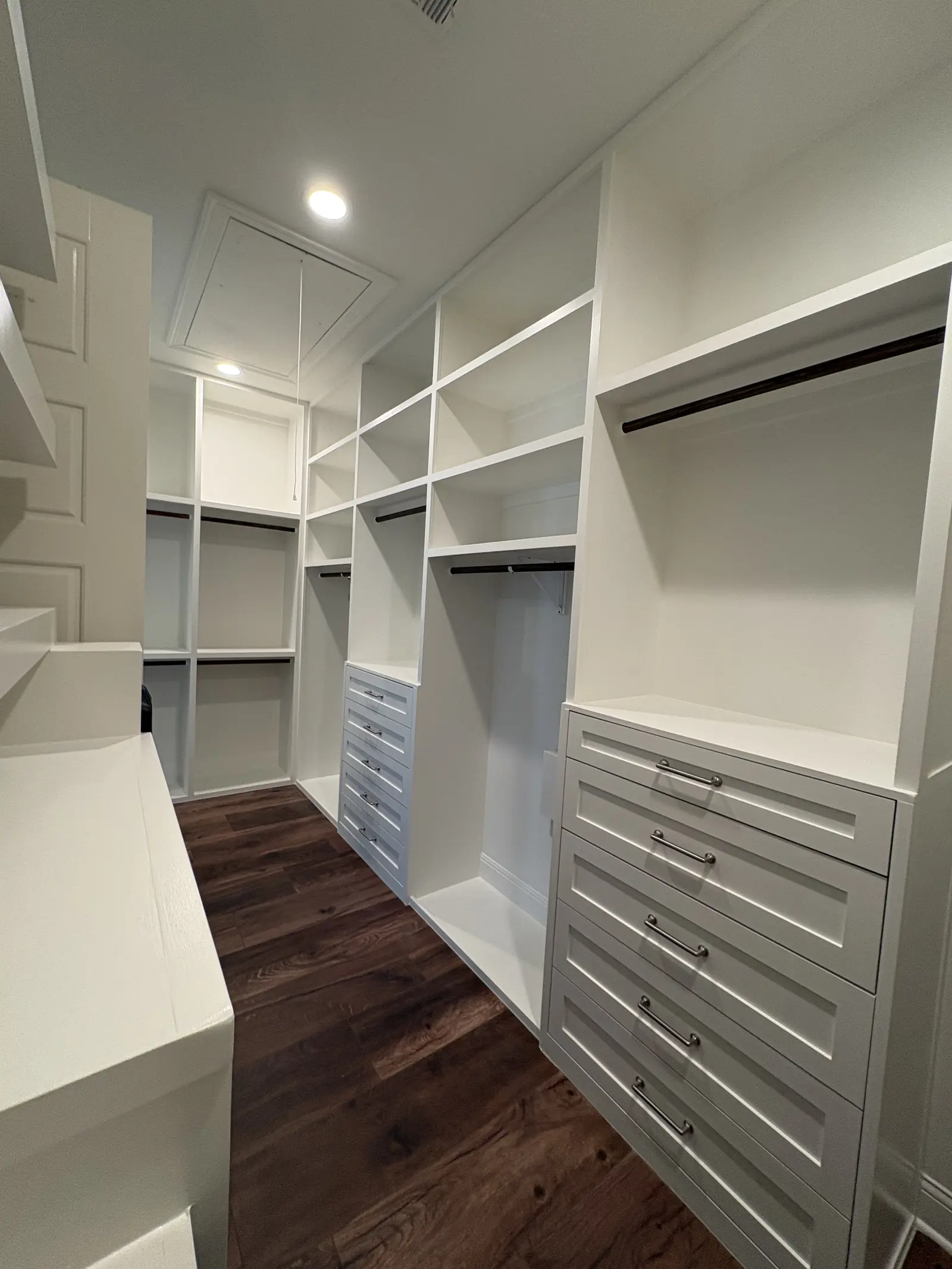 Closet shelving and drawer bank fitted wall to wall