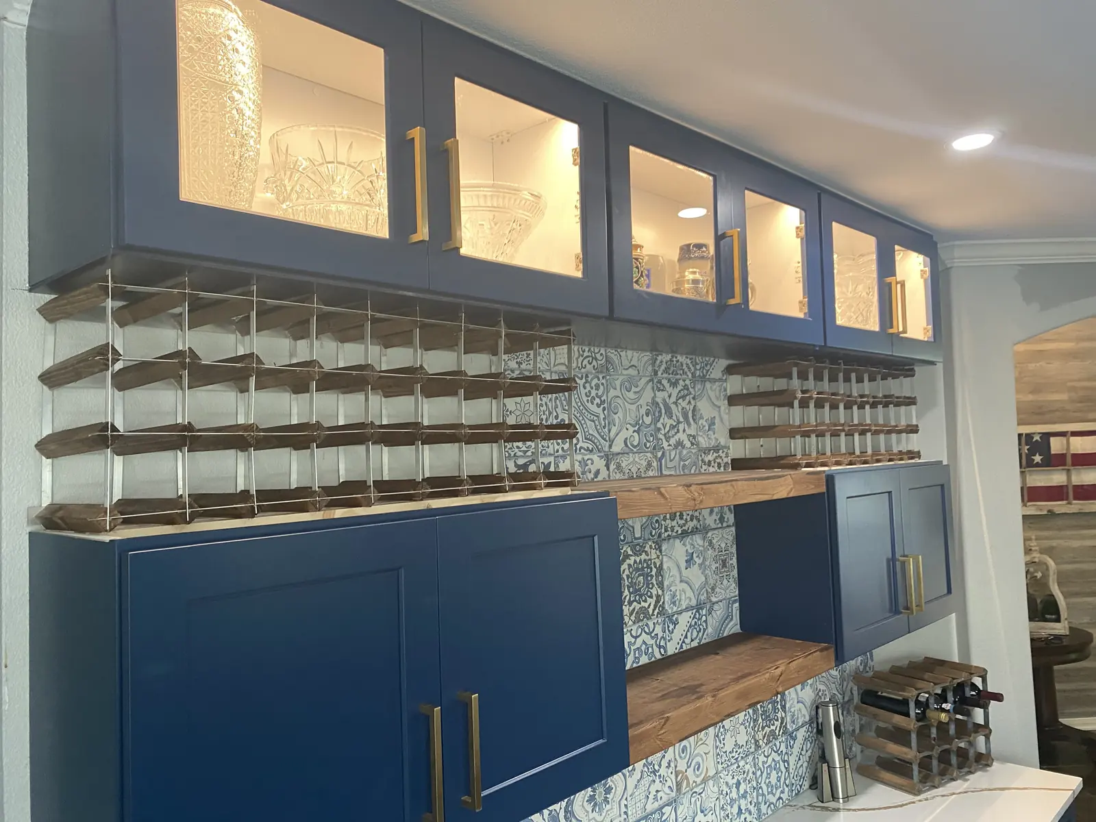 Hand built stained wine rack with rows of angled bottle cradles